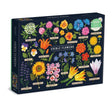 Puzzle box with colorful illustrations of edible flowers on a dark blue background