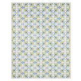 Patterned blanket with blue and green floral design on a white background