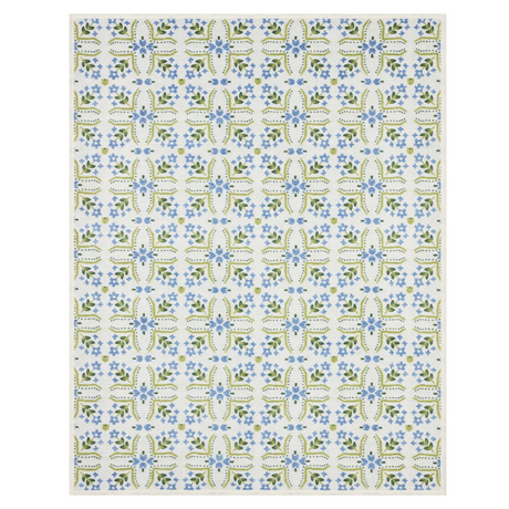 Patterned blanket with blue and green floral design on a white background