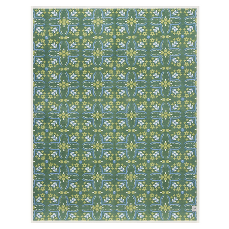 Patterned blanket with green and blue design on a white background