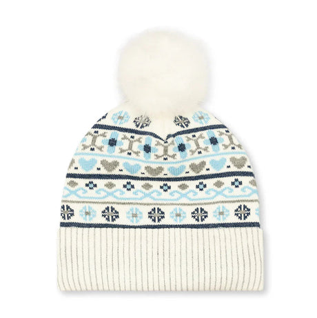 A cream-colored knit beanie hat featuring a white faux fur pom-pom on top and a colorful Fair Isle pattern with light blue, navy, and gray motifs on the upper section, finished with a solid cream ribbed cuff.