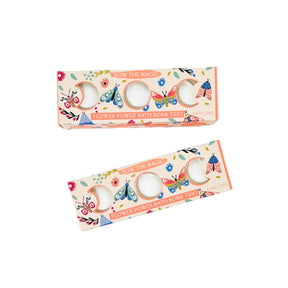 Two boxes of 'Flower Power Bath Bombs Trio' with butterfly designs on a white background.