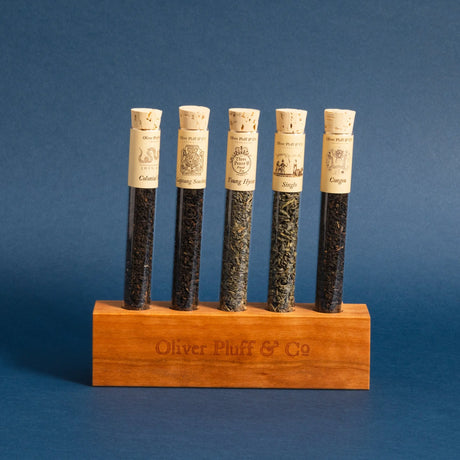 the teas of the boston tea party in their display block against a deep blue background