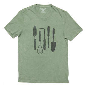 a light green tee shirt with hand drawn illustration of five common garden tools