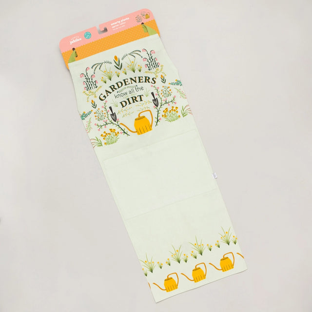 Gardening-themed apron folded and attached to its display packaging