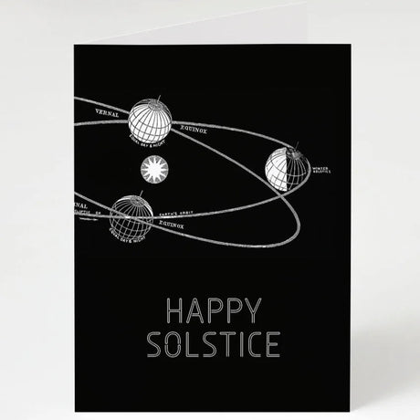 a black astronomy themed greeting card that reads "happy solstice" that shows the earth's rotation around the sun marking where in its rotation the equinox and solistice are