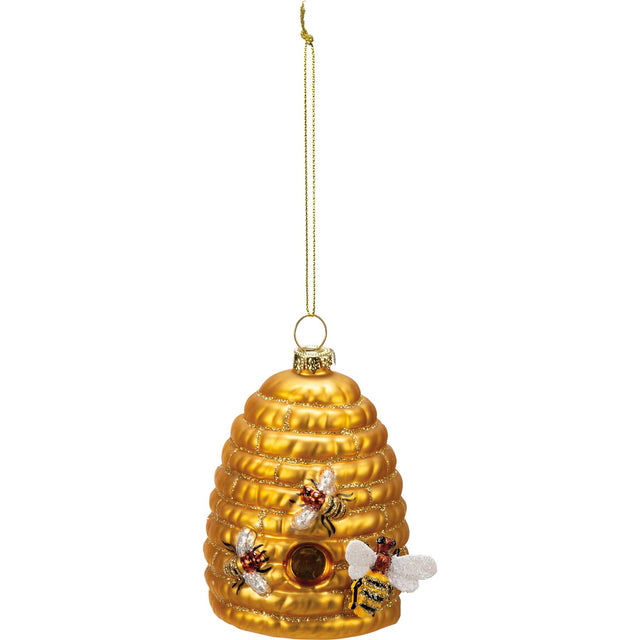 Gold honeycomb ornament with bees on a white background
