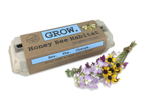 The Grow Honey Bee Habitat package alongside a bouquet of fresh cut flowers that bees love