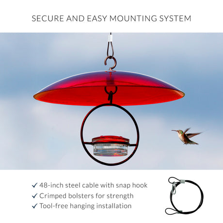 Red hummingbird feeder with hanging system against a clear blue sky and text- "Secure and Easy Mounting System- 48-inch steel cable with snap hook, crimped bolsters for strength, tool-free hanging installation"