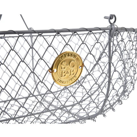 a close up of the gold emblem on the side of the large harvest basket