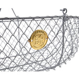 a close up of the gold emblem on the side of the large harvest basket