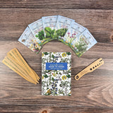 Set of seed packets and a guidebook on a wooden surface