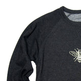 Dark gray sweatshirt with a bee design on a white background