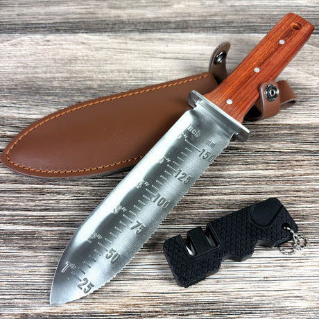 Knife with wooden handle and leather sheath on a wooden surface