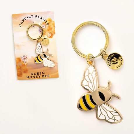 Gold bee-shaped keychain with a card labeled 'Queen Honey Bee' on a white background