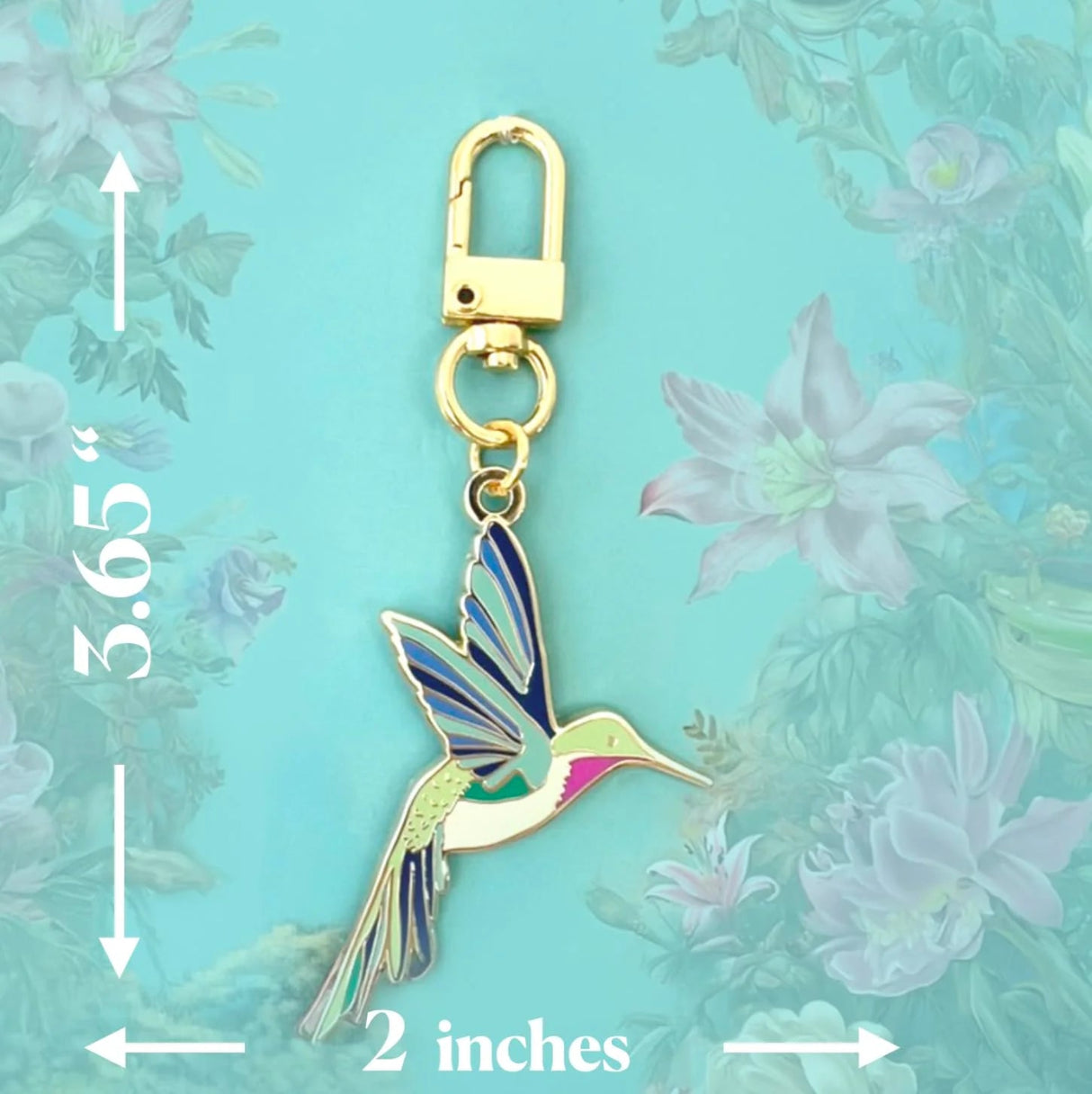 Hummingbird keychain with measurements on a floral background