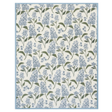 Floral patterned blanket with blue lilac flowers and green leaves on a white background