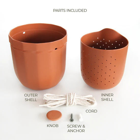 the terracotta loop planter and all of its parts and pieces: outer shell, inner shell, knob for the wall, screw and anchor, and hanging cord