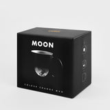 Black box packaging for a 'MOON' color-changing mug on a light gray background