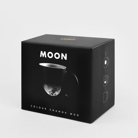 Black box packaging for a 'MOON' color-changing mug on a light gray background