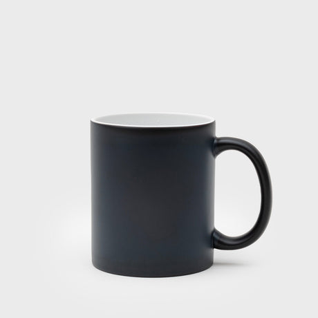 Black mug on a light gray background