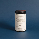 Colonial Bohea tea tin showing the back label against a deep blue background
