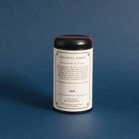 Colonial Bohea tea tin showing the back label against a deep blue background