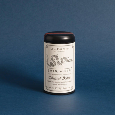 Colonial Bohea tea tin on a deep blue background