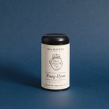the Young Hyson tea tin against a deep blue background
