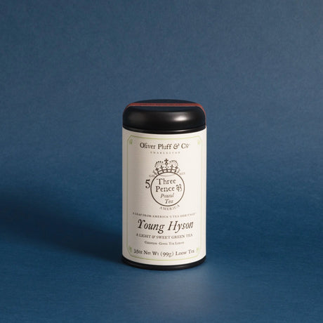 the Young Hyson tea tin against a deep blue background