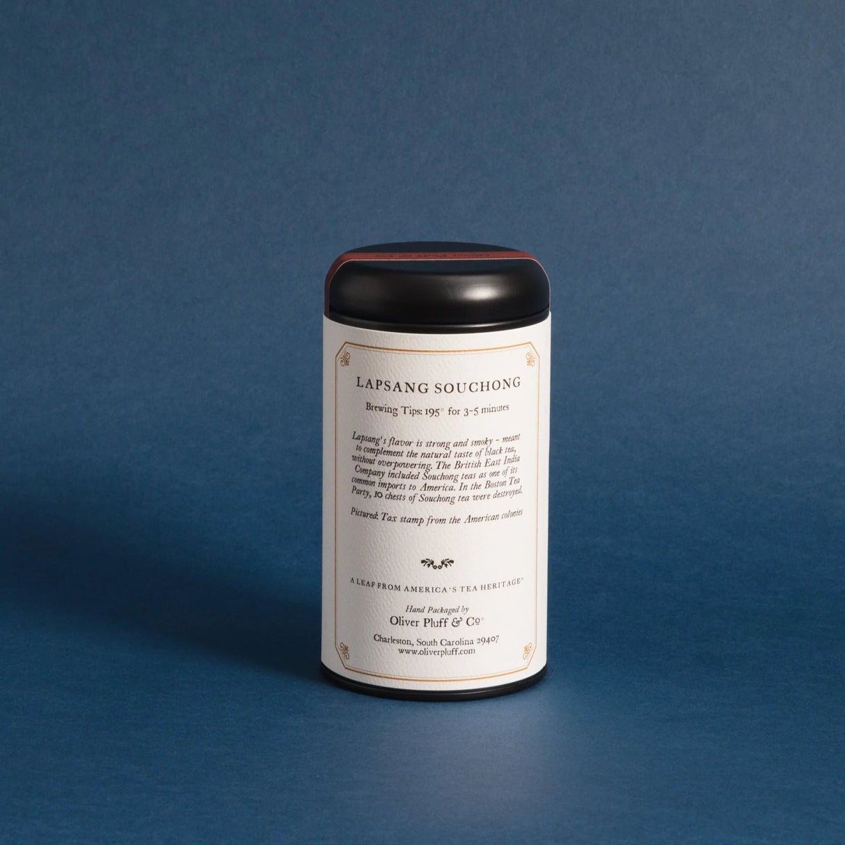 the backside of the lapsang souchong tea tin against a deep blue background