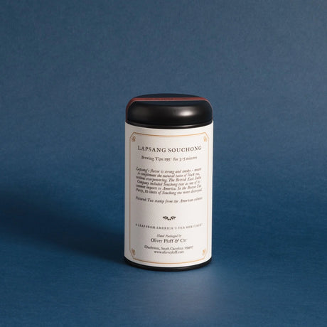 the backside of the lapsang souchong tea tin against a deep blue background