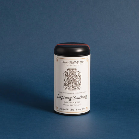 the lapsang souchong tea tin against a deep blue background