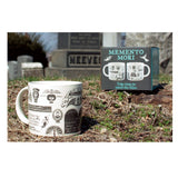 Memento Mori mug with decorative design in front of a gravestone