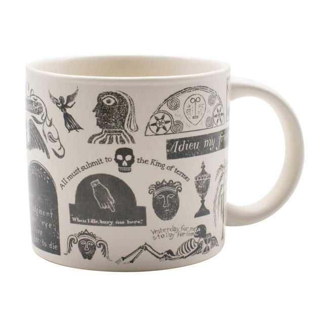 White mug with black gravestone illustrations and text on a white background