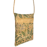 Cork crossbody bag with lush botanical pattern on a white background