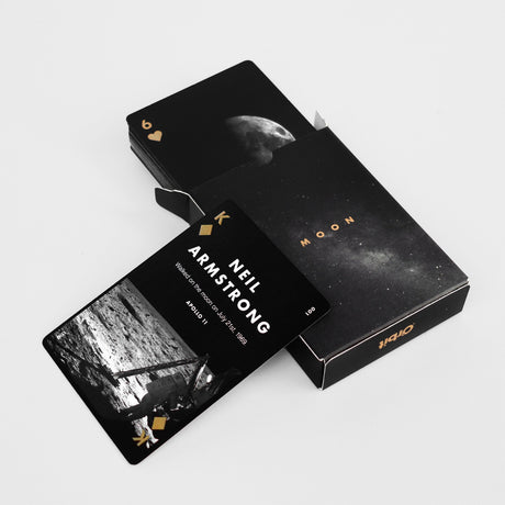 Playing cards with Neil Armstrong design on a white background