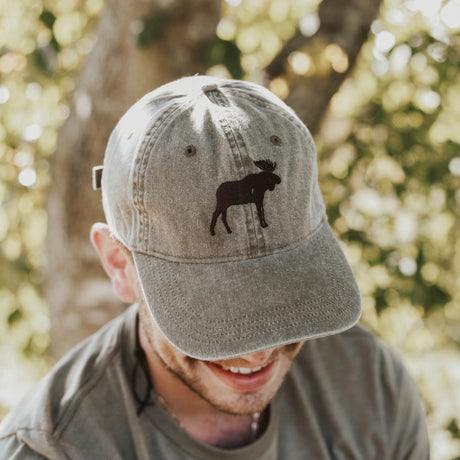 the moose cotton cap worn by a model enjoying the great outdoors