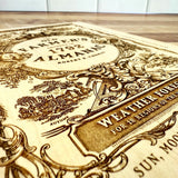 close up of the detail of the engraving on the 'Old Farmer's Almanac' cutting board featuring intricate designs and text.