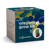 A square product box for an oregano grow kit by Sprigbox, shown on a clean white background. The box features a dark teal front with abstract botanical illustrations in blue, yellow, and green, white text reading 'oregano grow kit,' and a small circular photo of a potted oregano plant.