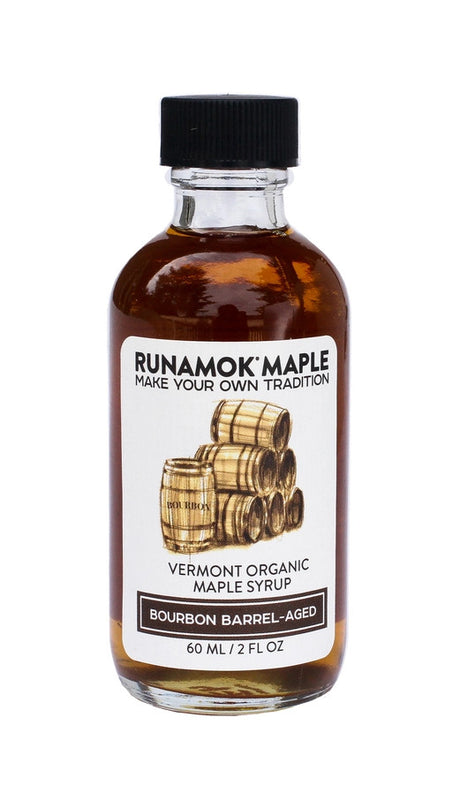 a bottle of the bourbon barrel aged maple syrup from the pantry favorites collection against a white background