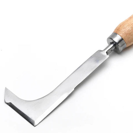a close up of the silver blade of the block paving knife
