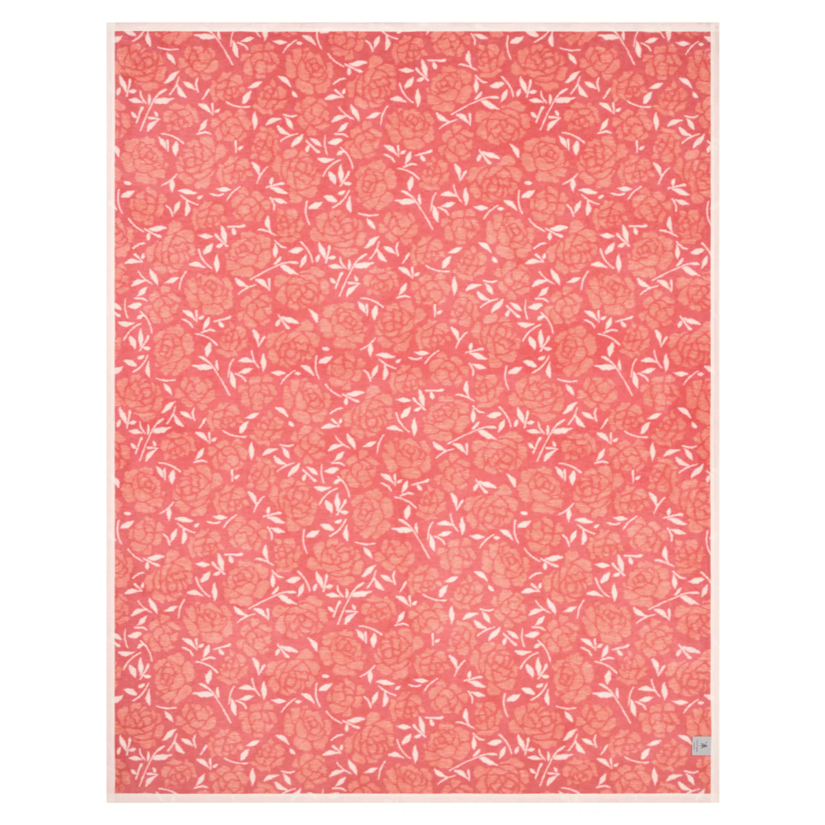 The reverse side of the Peony Petals blanket showing the dominant pink color