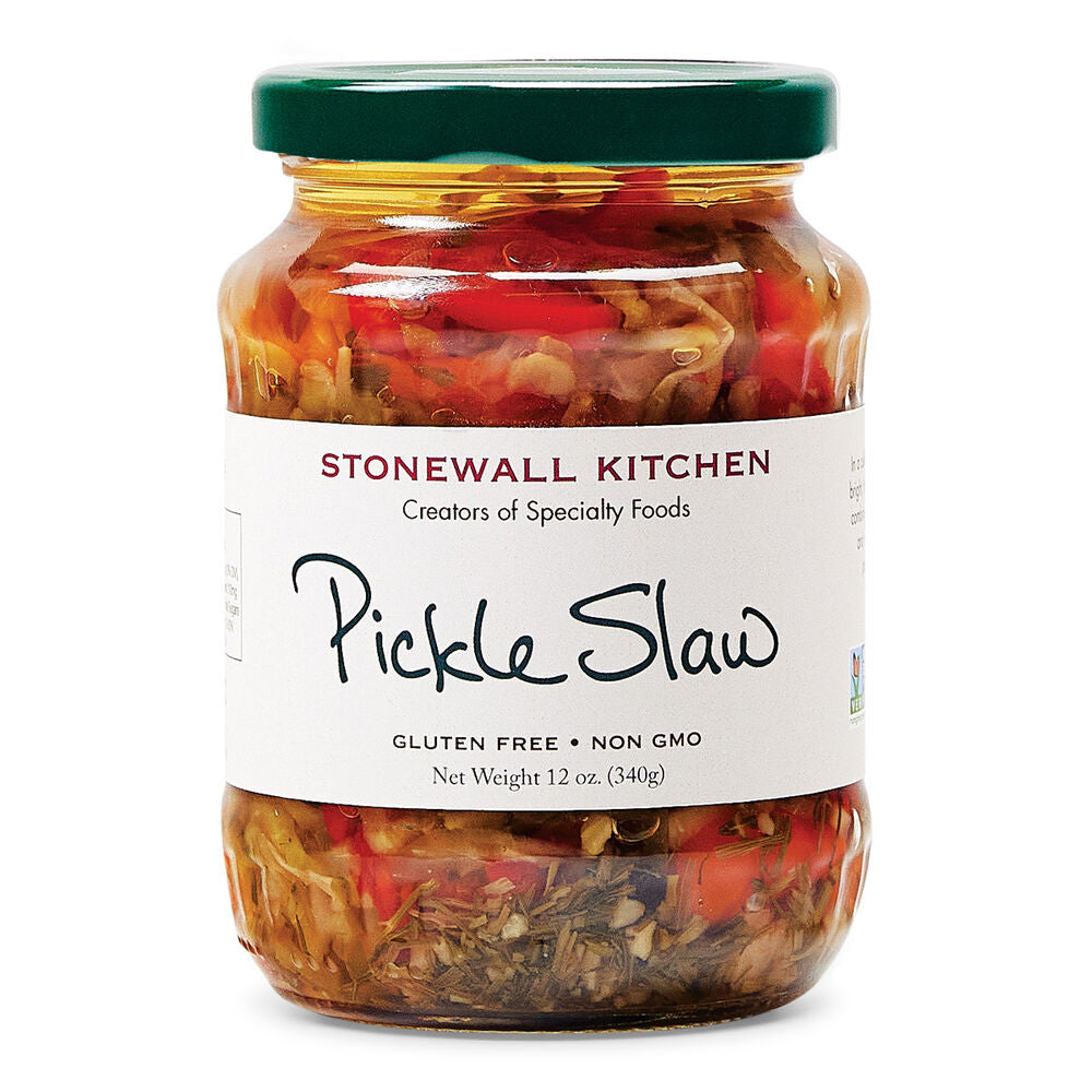 a wide jar of colorful pickle slaw with off white label and deep green jar lid