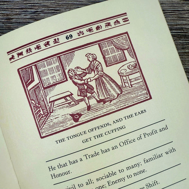 Interior page of Poor Richard's Almanack with illustration of a woman cuffing a man, text below