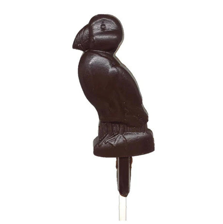 a dark chocolate pop, crafted in the charming shape of a puffin against a white background