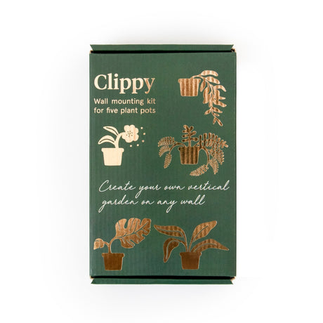 Green packaging of Clippy wall mounting kit for plant pots on a white background