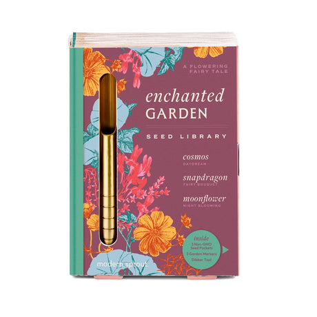 Seed library packaging with floral design and gold tool on a white background