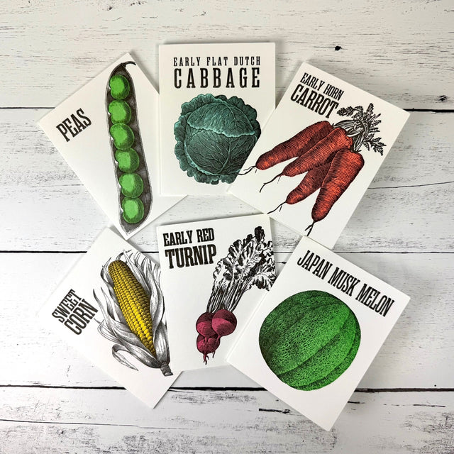 Set of 6 notecards with vintage-style seed packets with illustrations of vegetables on a wooden surface
