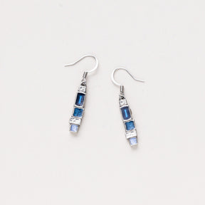 A pair of Danforth Pewter Stepping Stone earrings featuring asymmetrical blocks of vivid blue hues mixed with silver pewter, displayed on a white background